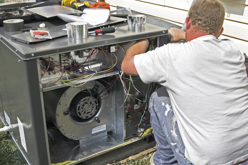 Contractor is installing new high efficiency air condition heat pump